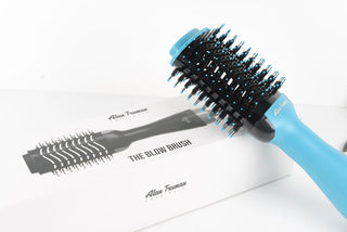 What is in the blow brush that gives smooth and shiny hair?